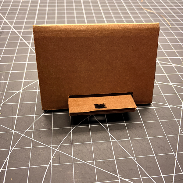This design is a varitation of both the first and the second phone stand tutorials. The aesthic is similar to the first tutorial. We added a phone charger hole to the design to enhance its functionality. This modification shows how guerrilla prototyping allows for easy customization and adaptation of existing designs to better meet user needs. We then added a second side to it to make it so two phones could be propped up at once, this was taken from the second tutorial.